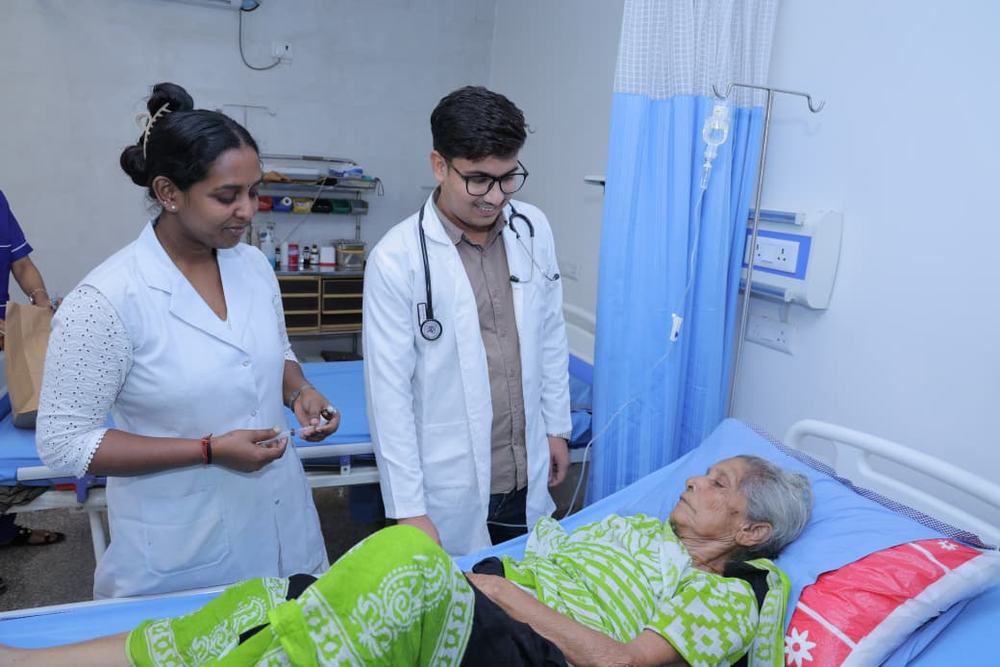 Doctor and nurse on rounds with a patient
